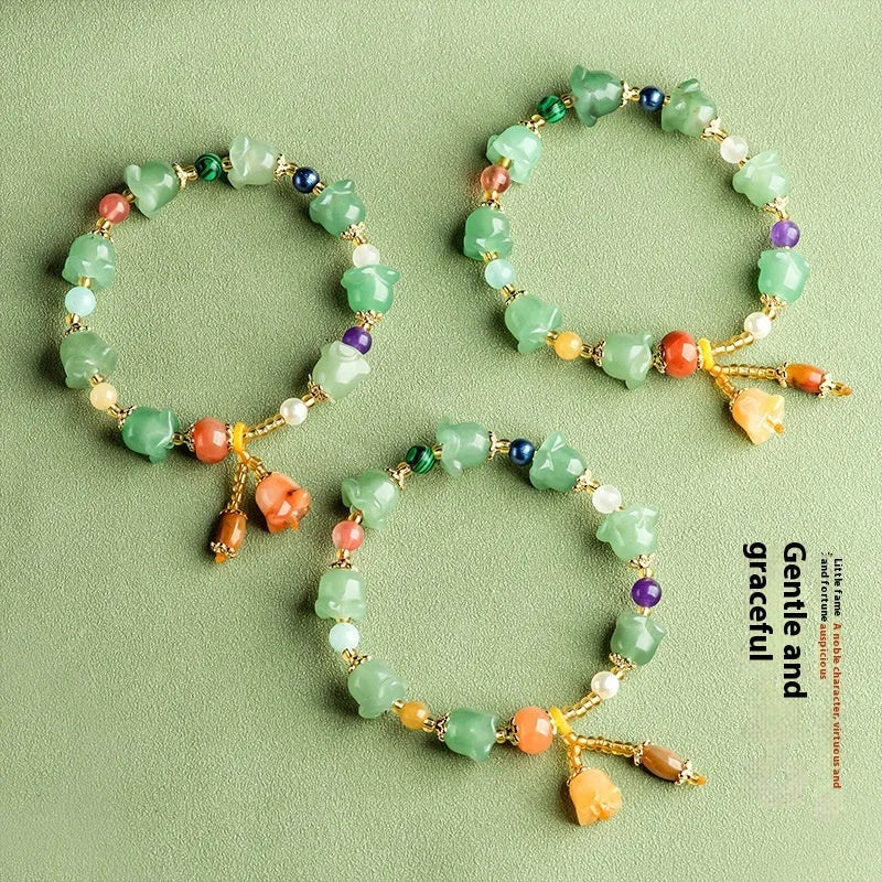 Women's natural jade orchid bracelet with carved beads for 14-18cm wrist.
