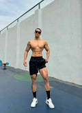 Men's ice silk quick-drying double-layer shorts in quarter length on a neutral background.