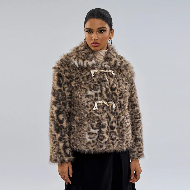 Women's leopard print coat with a buckle lapel closure on a hanger.