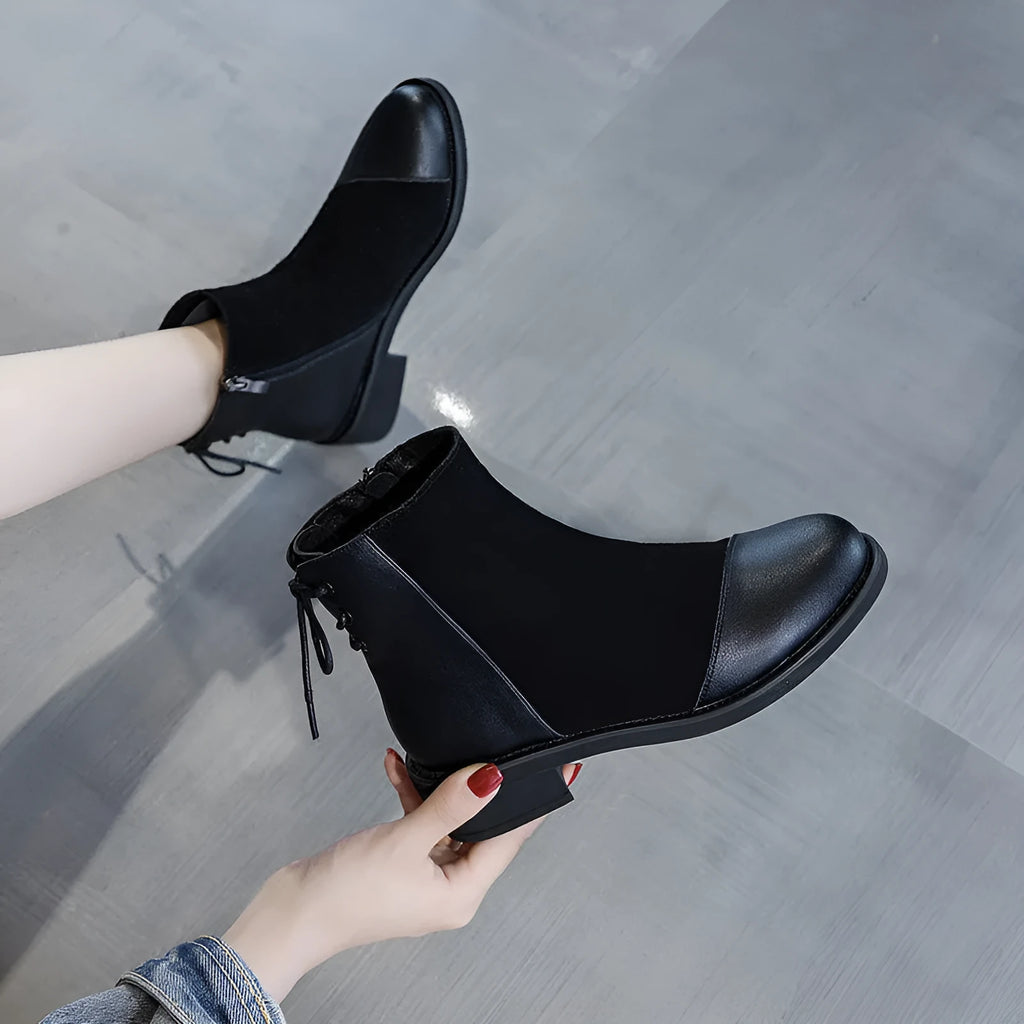 Black women's knee-high Martin boots with side zip and bow detail on a microfibre upper.