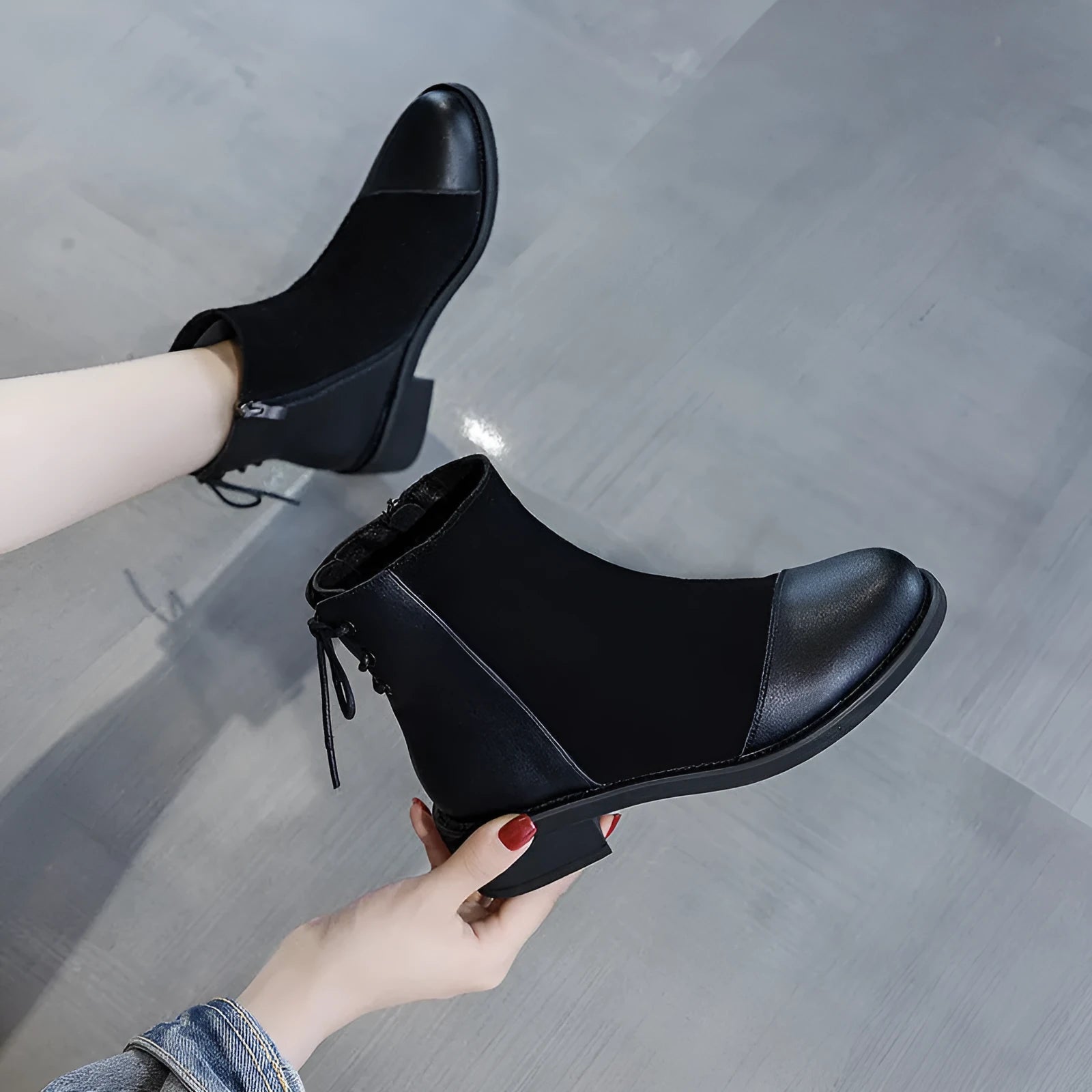 Black women's knee-high Martin boots with side zip and bow detail on a microfibre upper.