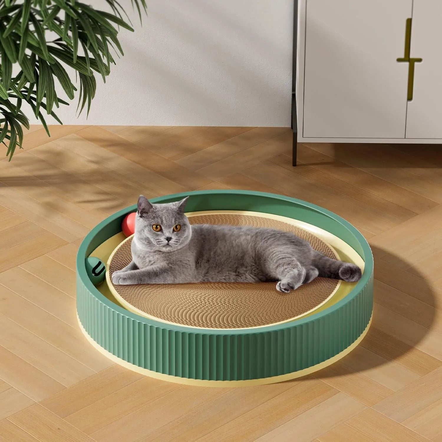 Large circular cat scratching board with moving ball toys measuring 45cm diameter