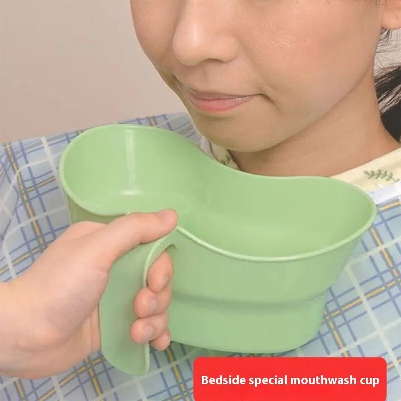 Green plastic medical gargle cup with swivel cover for bedridden patient oral care.
