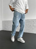 Men's straight-leg denim jeans with mid-waist design showing front view