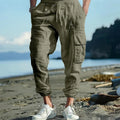 Men's loose-fit linen casual trousers with ankle ties and multiple pockets in Army Green.