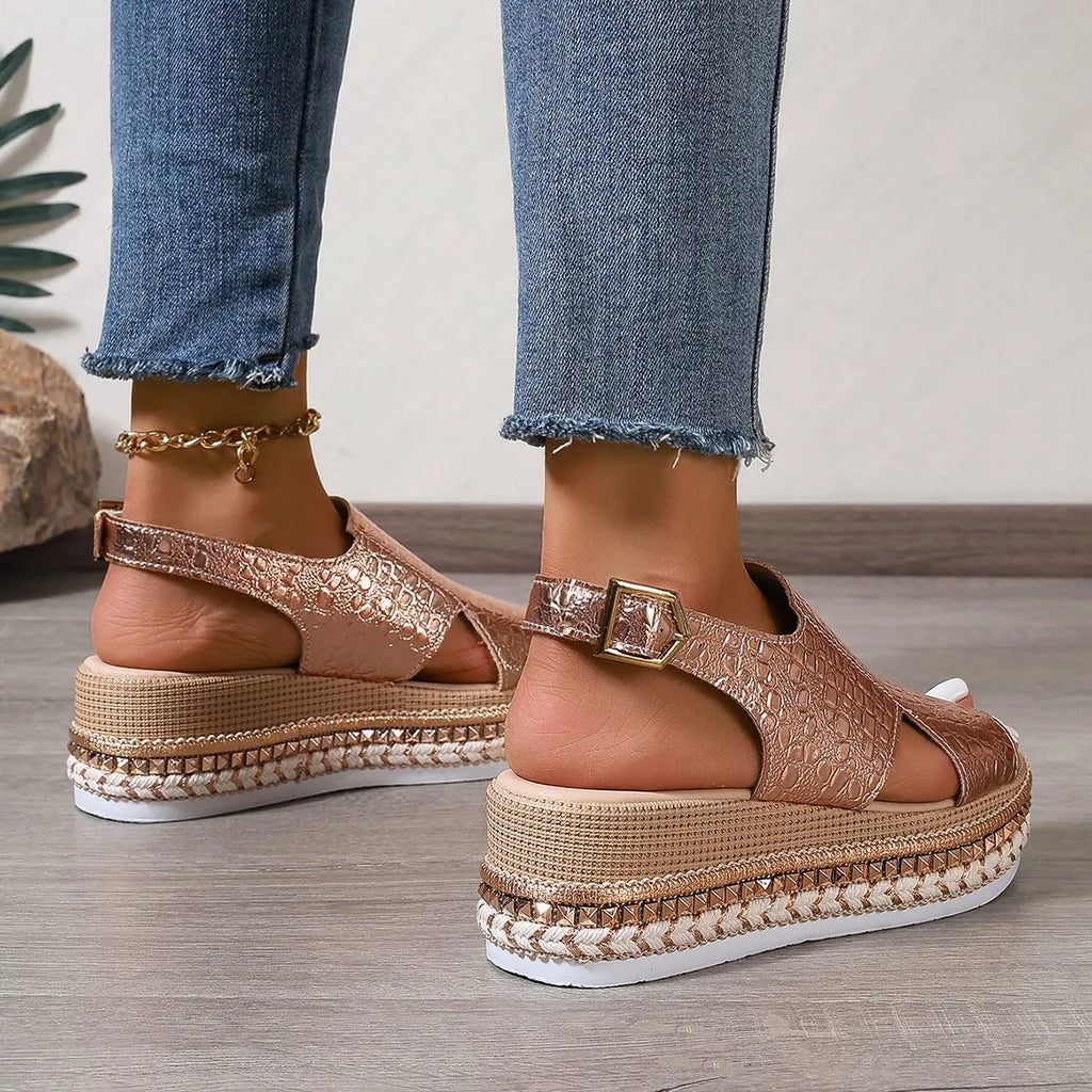 Gold women's Roman shoes with round toe, hollow-out design, and adjustable ankle buckle