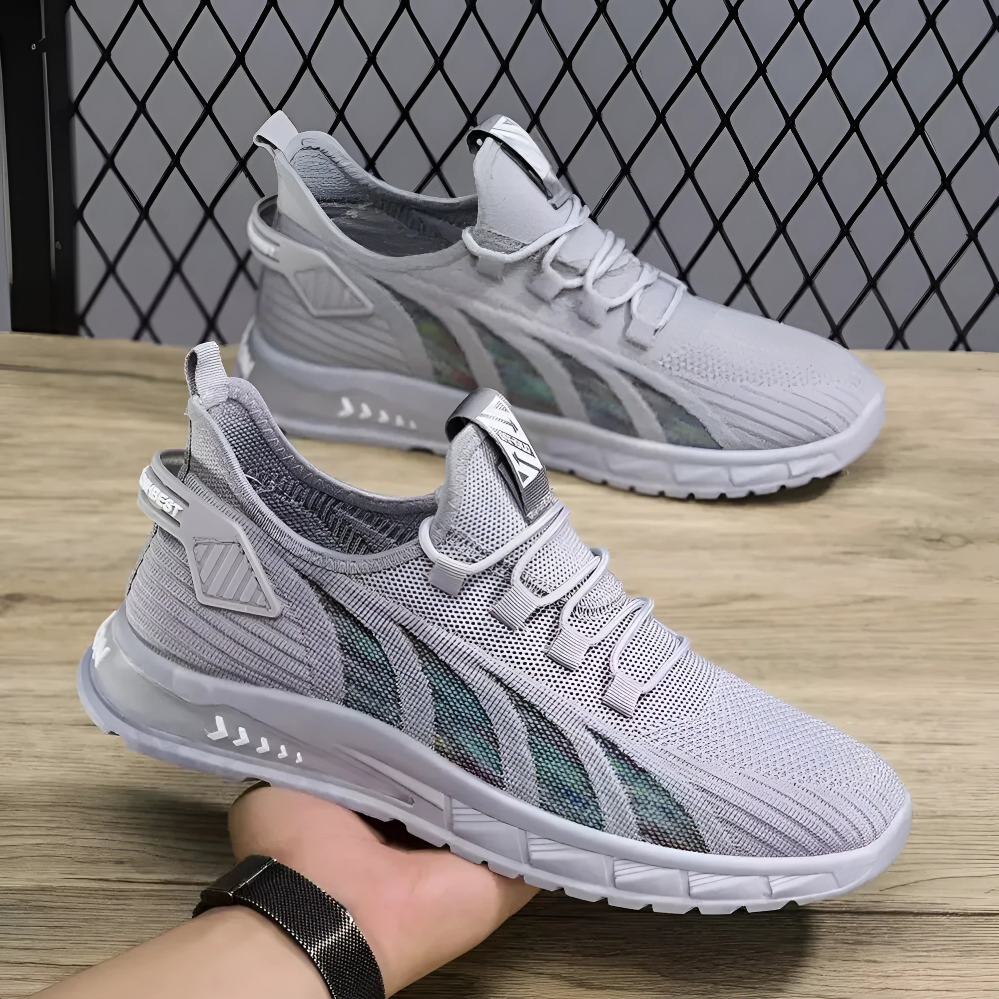 Low-top mesh sneakers in various colours on a flat sole, showing the shallow-cut upper.