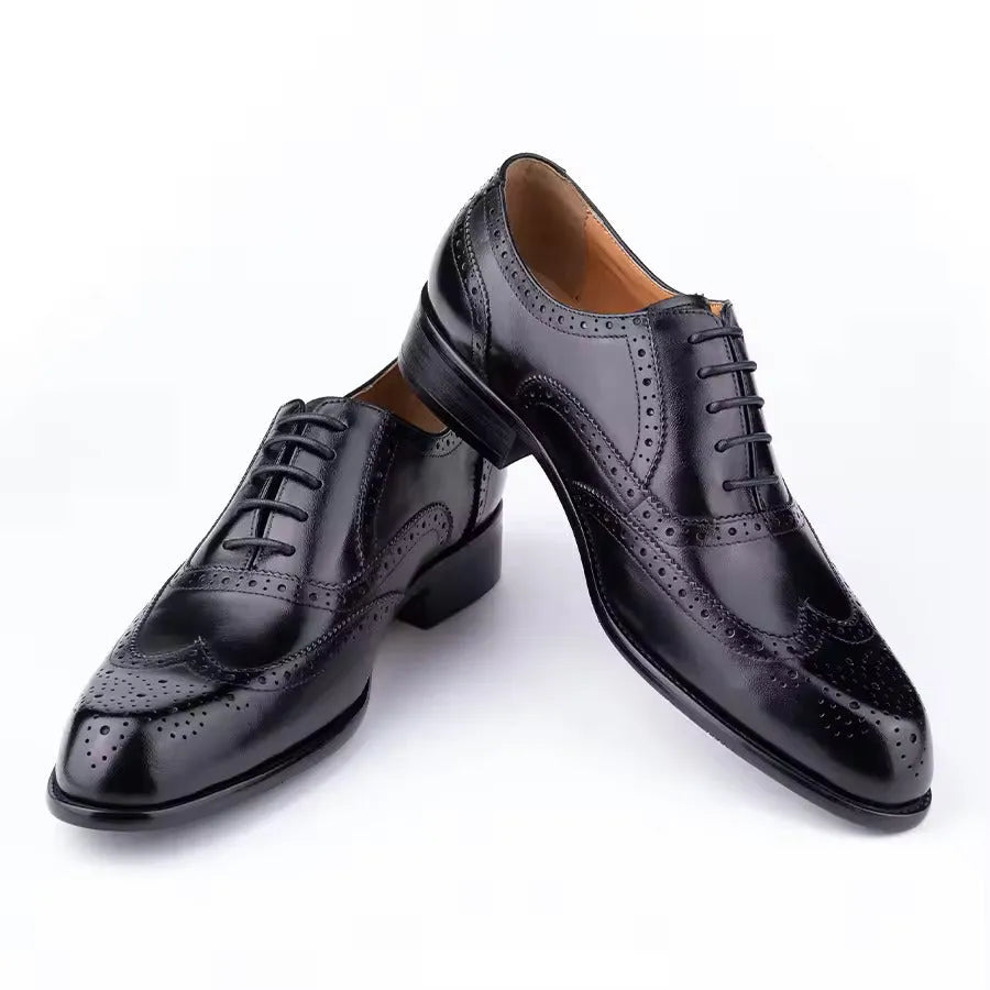 Men's purple Oxford shoes with hand carved detailing and pointed toe style on rubber sole