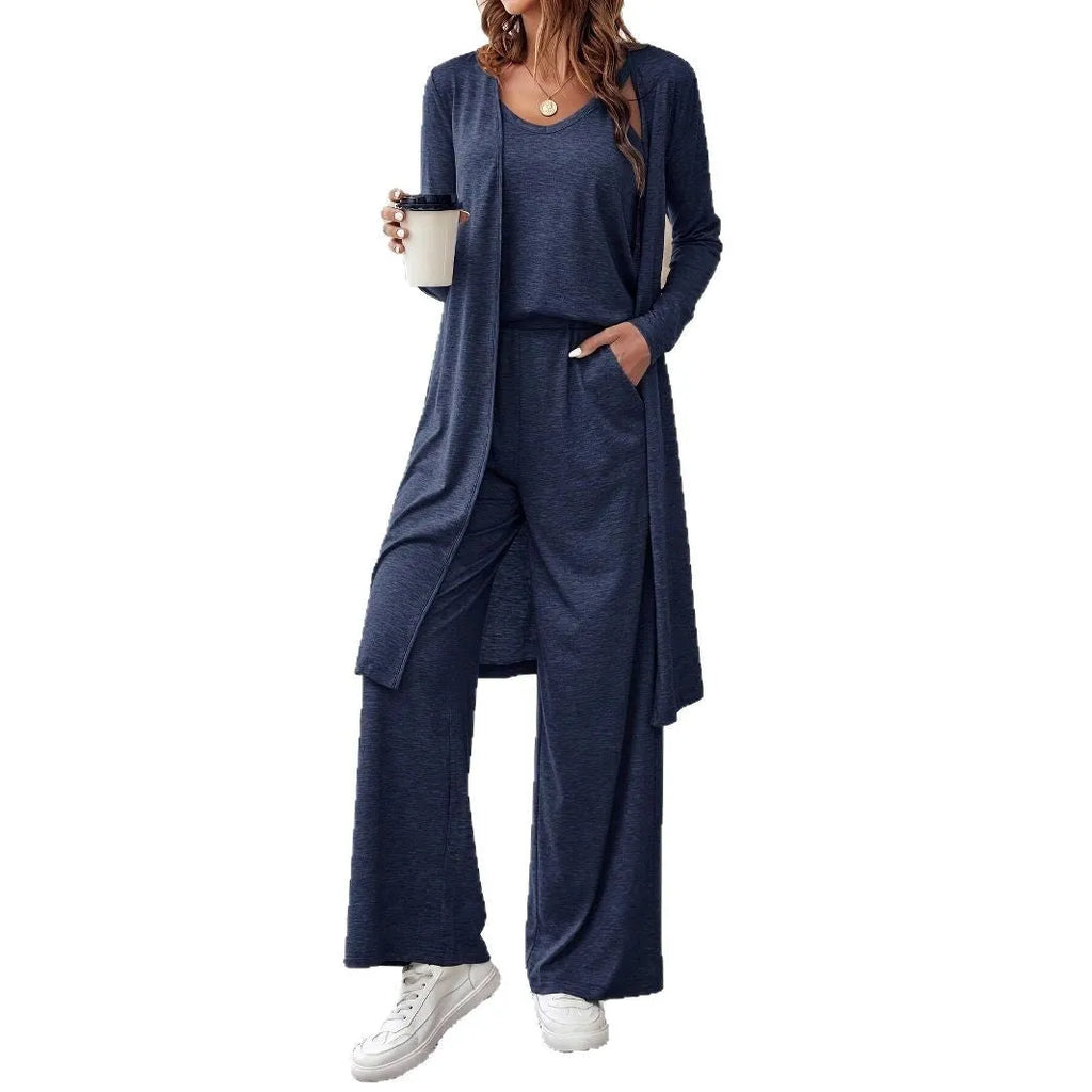 Blue women's three-piece casual suit with sling top, cardigan, trousers, and suspenders.