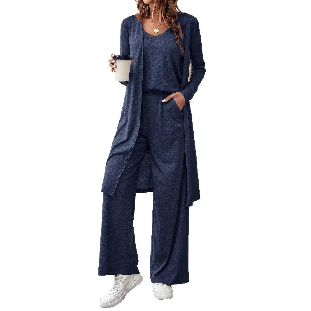 Blue women's three-piece casual suit with sling top, cardigan, trousers, and suspenders.