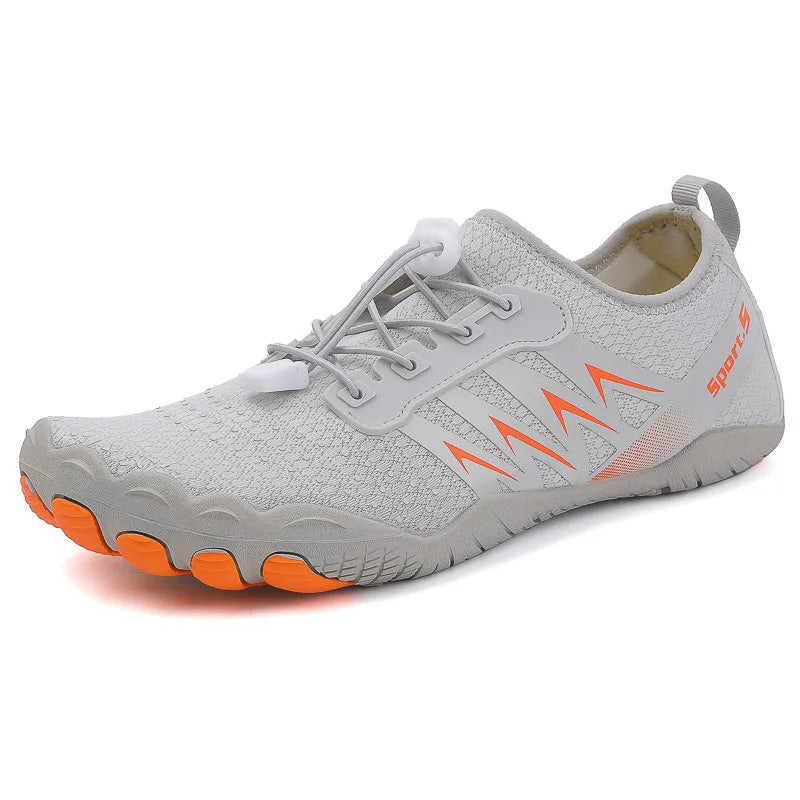 Low-top river tracing shoes in apricot colour with mesh upper and rubber sole.