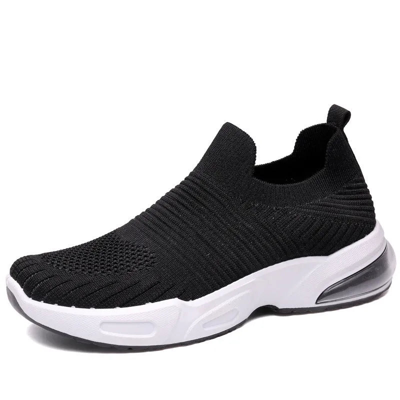 A pair of breathable mesh slip-on sock shoes with a PVC sole, shown in black colour.