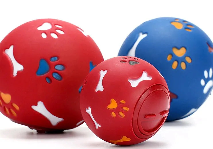 Pet puzzle ball for dogs with skeleton and footprint patterns, blue or red, 7.5cm and 11cm sizes