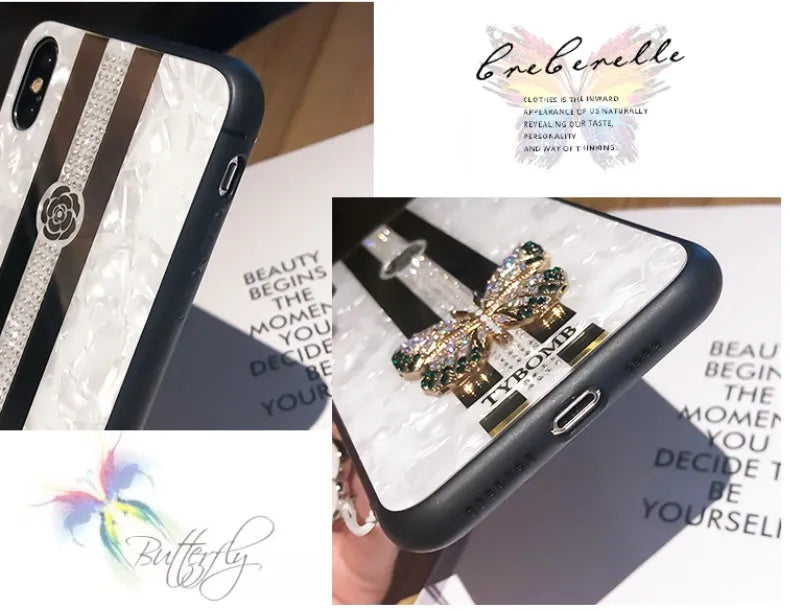 Pearl-coloured acrylic iPhone case with diamond patterns, butterfly design, and a central mirror panel.