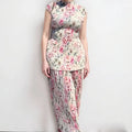 Long sleeve printed chiffon dress and matching skirt set on a hanger, high waist design