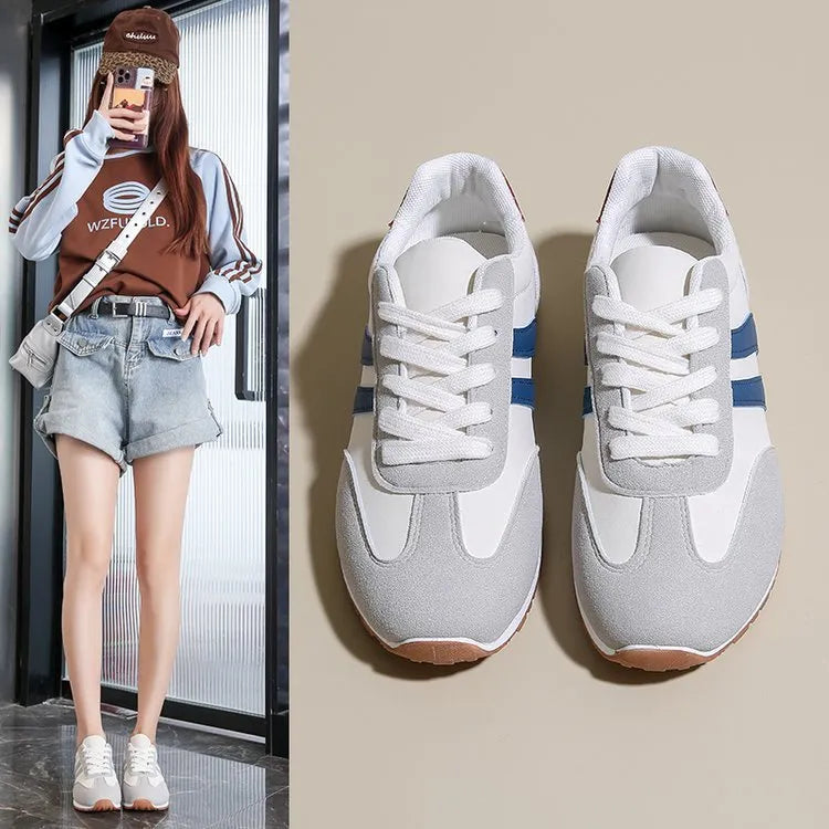 Blue and grey Cortez stripe casual sports shoes with flat heel and round toe on a wear-resistant rubber sole.
