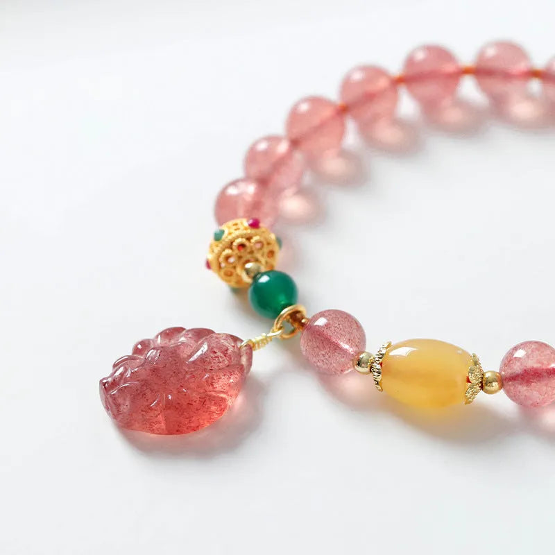 Women's strawberry quartz crystal bracelet with nine tail fox bead design