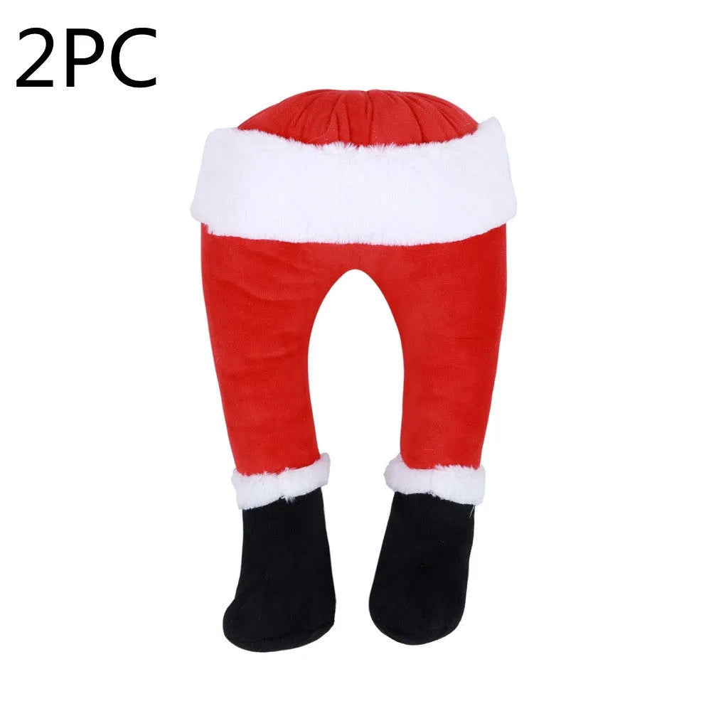Two white fabric elf legs decorating a Christmas garden display, overall length 38cm