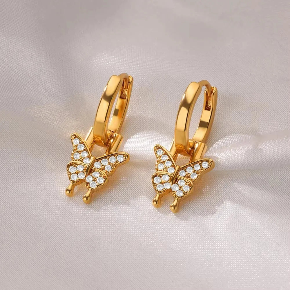 Women's copper butterfly earrings with heart, bow, and star geometric shapes in multiple colours.
