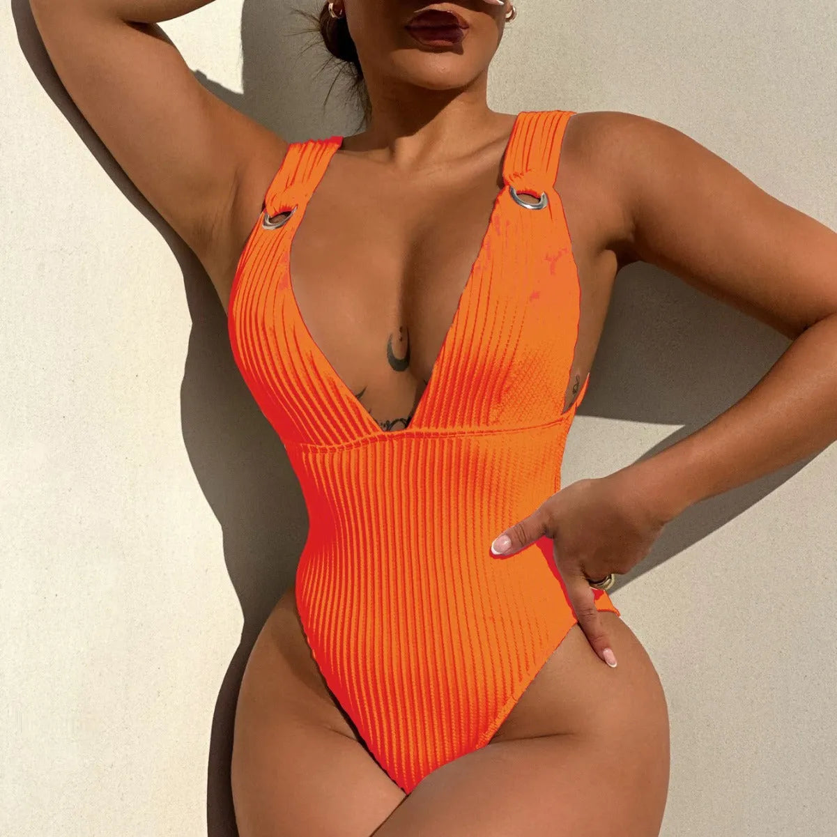 Solid colour one-piece swimsuit for women in black, shown on a model.