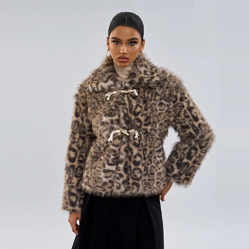 Women's leopard print coat with a buckle lapel closure on a hanger.