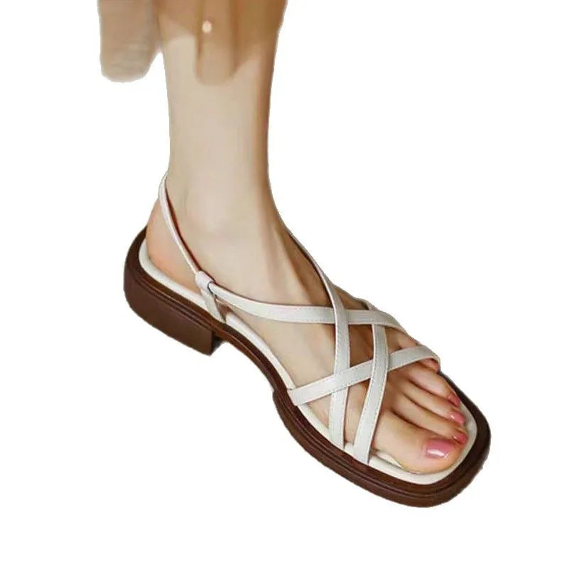 Women's cross strap buckle sandals with square toe, open toe, flat rubber sole, in milky white, black, or brown