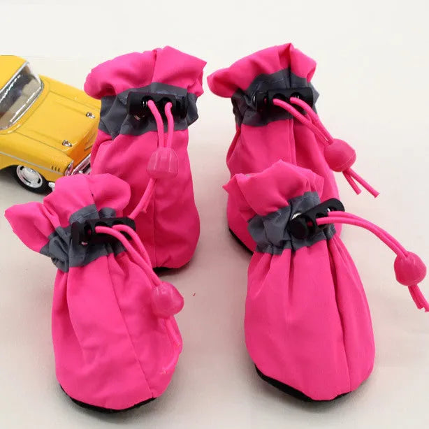 Set of four custom pet shoe foot covers with reflective strip and non-slip rubber sole in black, blue, red, yellow