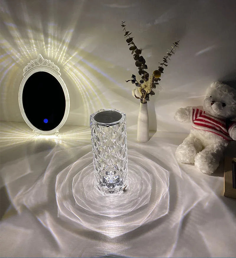 Romantic LED rose diamond table lamp with crystal-like PAMA acrylic construction on a table