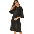 Black mid-length A-line dress with long sleeves, elasticated waist, and a detachable red belt.