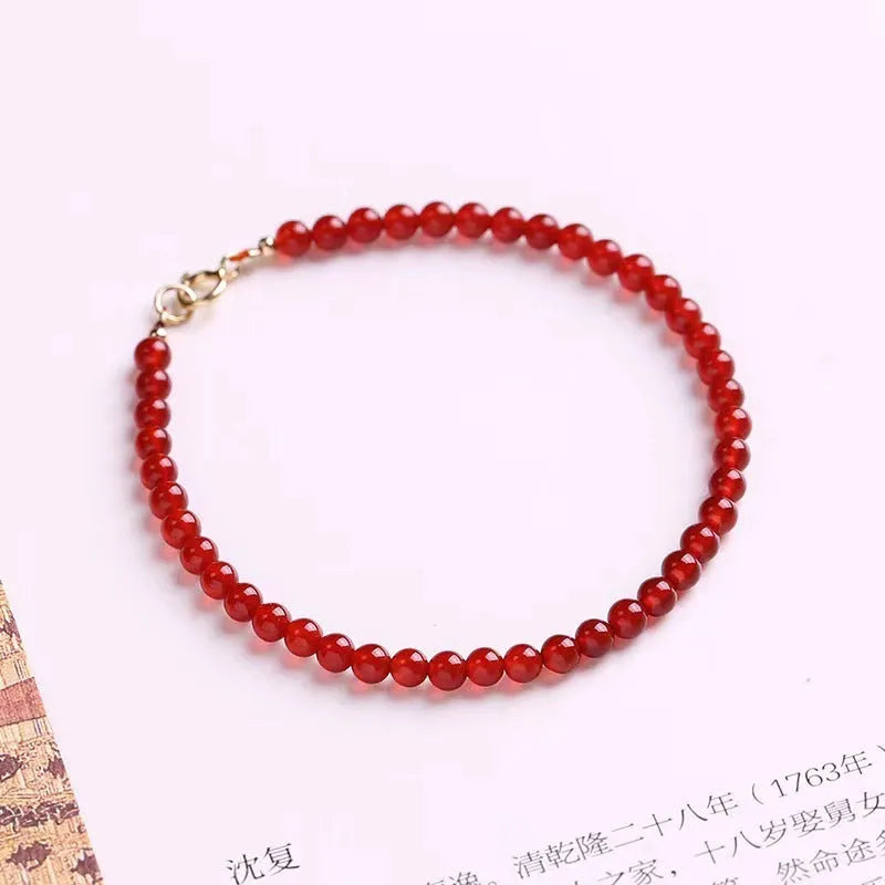 Ultra-thin classic red agate bracelet for women on a white background.