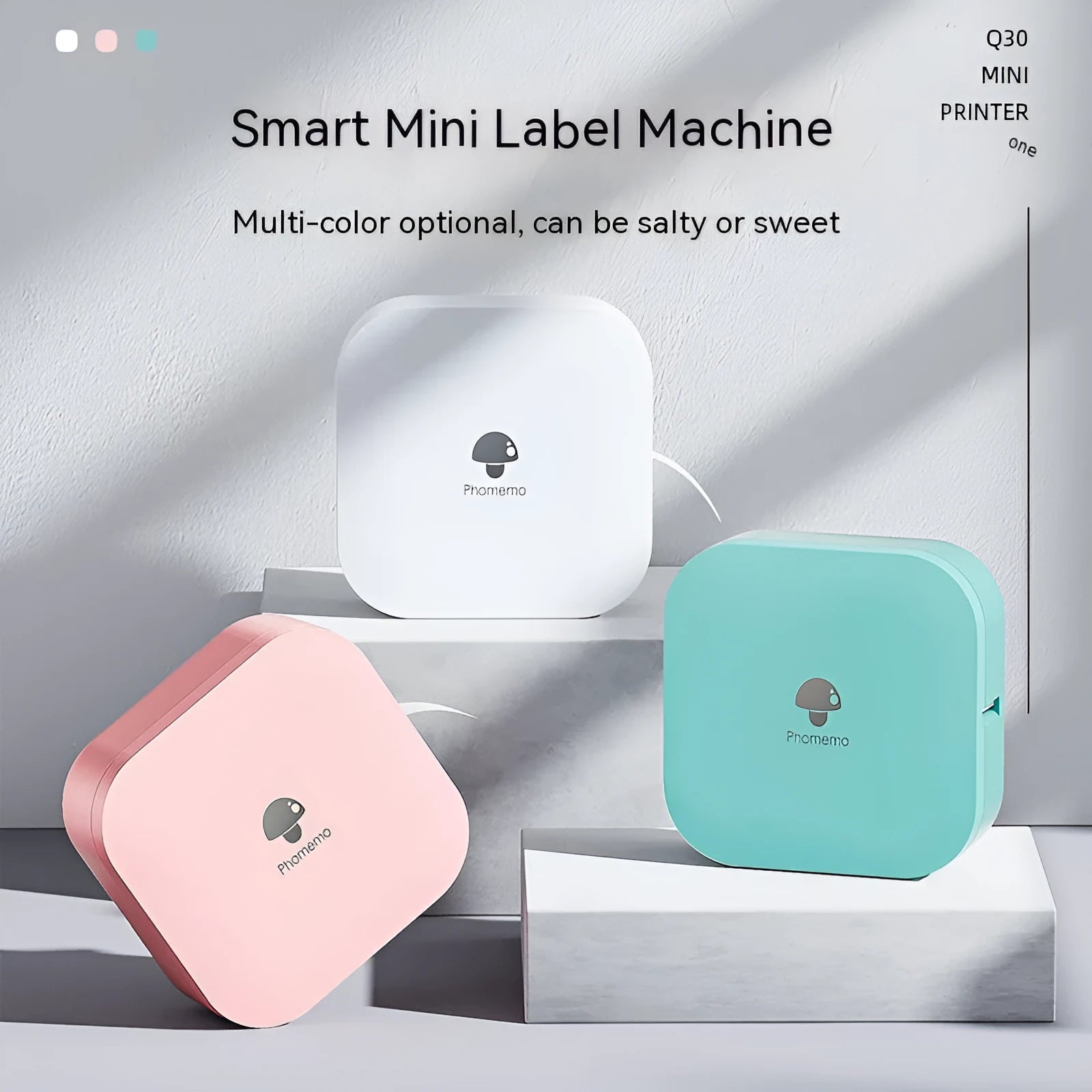 Q30 thermal mini label printer in green, compact size 82x82x32mm, with self-adhesive paper roll on white background