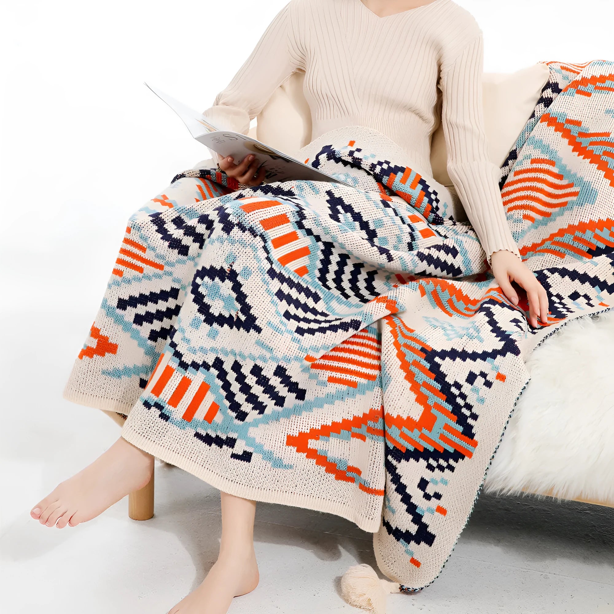Bohemian-style acrylic knit sofa blanket with tassels in a geometric pattern