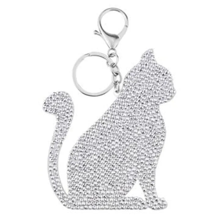 Diamond painting keychain kit showing four animal designs: ladybird, Santa Claus, unicorn, and owl with resin diamonds and metal keyring