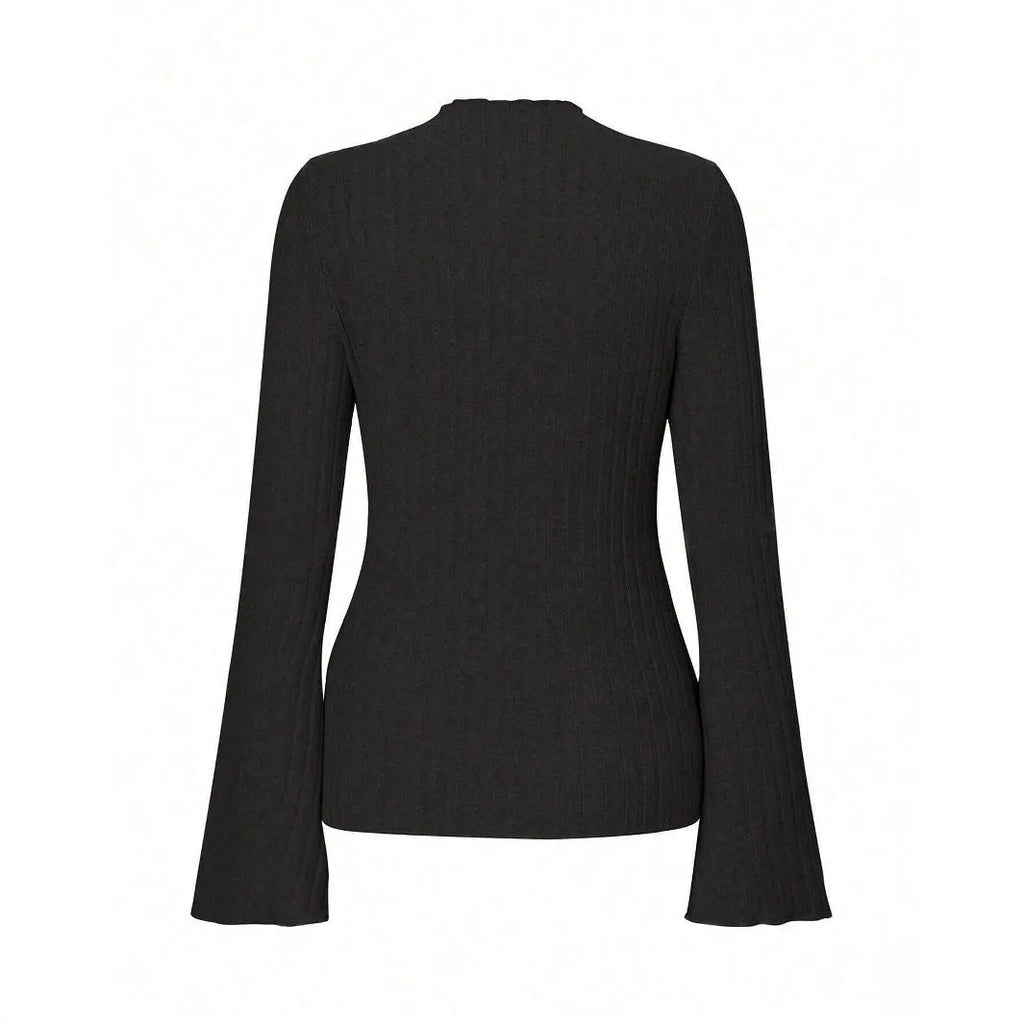 Long sleeve casual top in black with lantern sleeves and a sunken stripe pattern, laid flat.