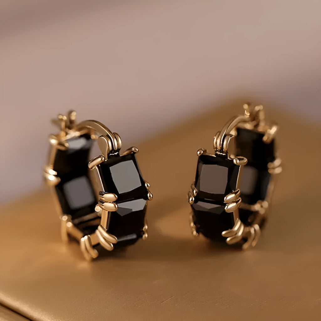 Geometric U-shaped copper earrings with round crystal zirconium accents in gold electroplated finish