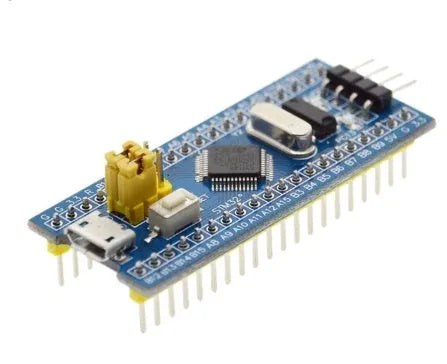 STM32F103C8T6 ARM Cortex-M3 microcontroller development board with blue PCB and pin headers.