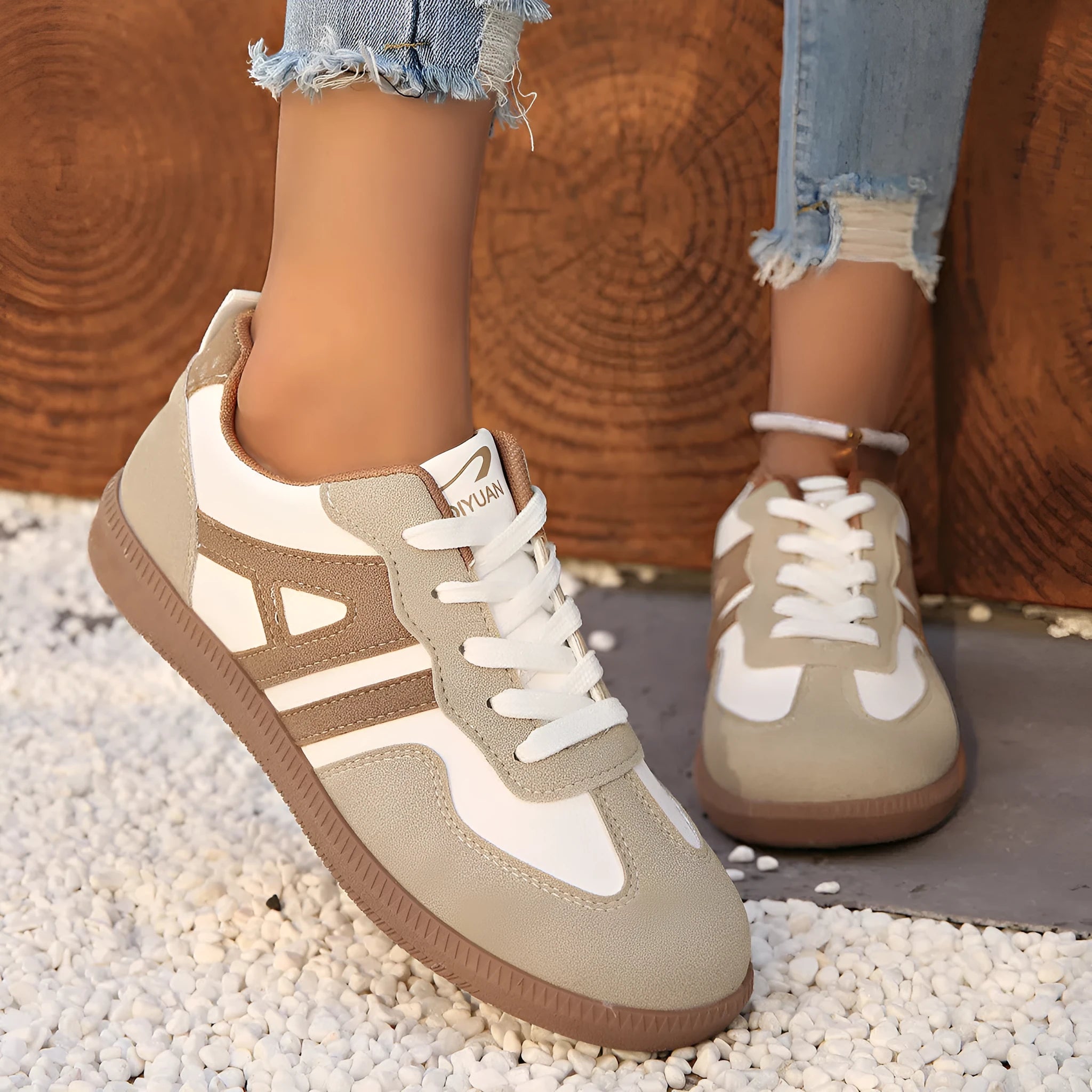 Women's retro colour matching lace-up jogging shoes with platform heel and cross-strap detailing in black, grey, and khaki options