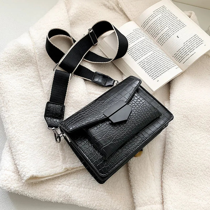 A PU fabric crossbody bag with an adjustable strap, shown in dark brown colour.