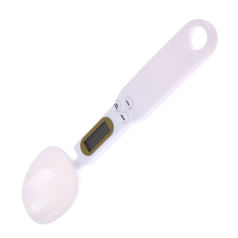 White digital kitchen spoon scale with LCD display showing weight measurement