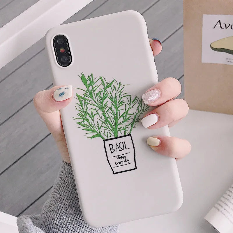 White silicone iPhone case with a detailed painted plant pattern on the back.