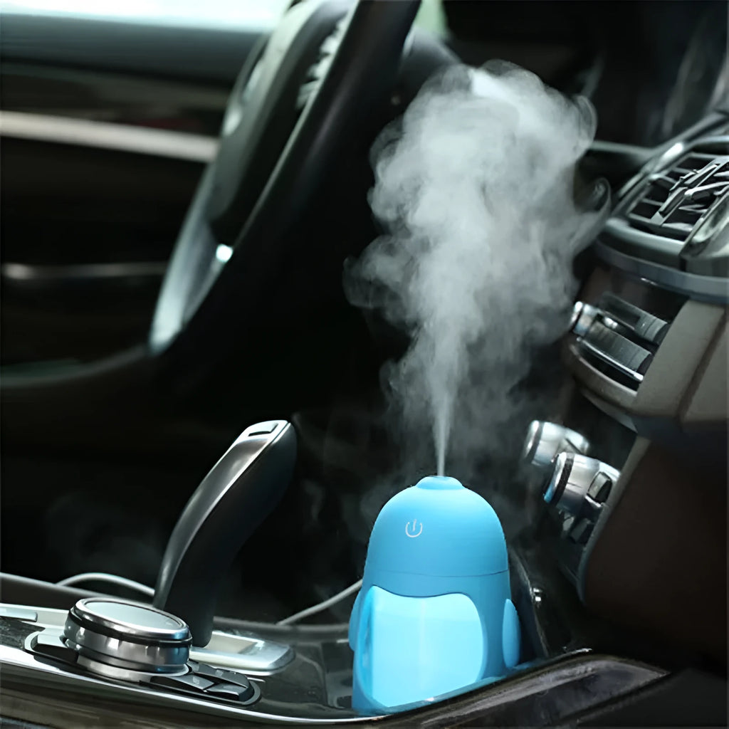 Penguin humidifier with soft blue nightlight glow, 150ml cool mist diffuser, USB powered, available in pink