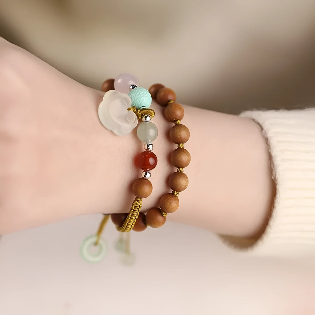 Hand-woven ebony women's bracelet with double ring design and decorative stone elements