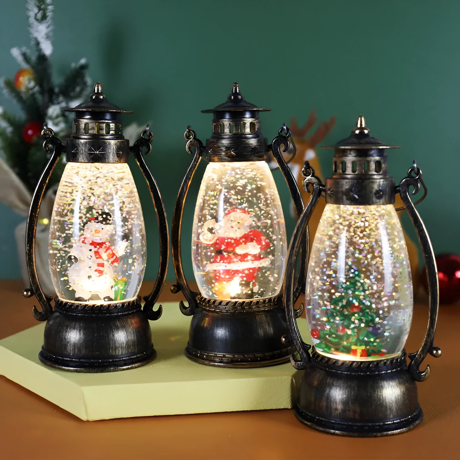 Plastic oil lamp snow globe ornament lit up with snowman figurine on a desktop.