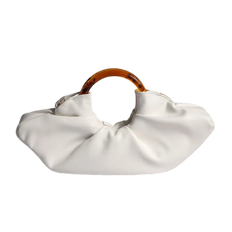 Niche Horn Bag acrylic ring handbag in black PU leather with fold design detail