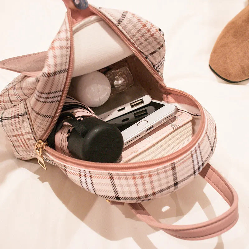One shoulder diagonal phone bag in PU fabric shown in one of five colours: black, blue, brown, pink, or red.