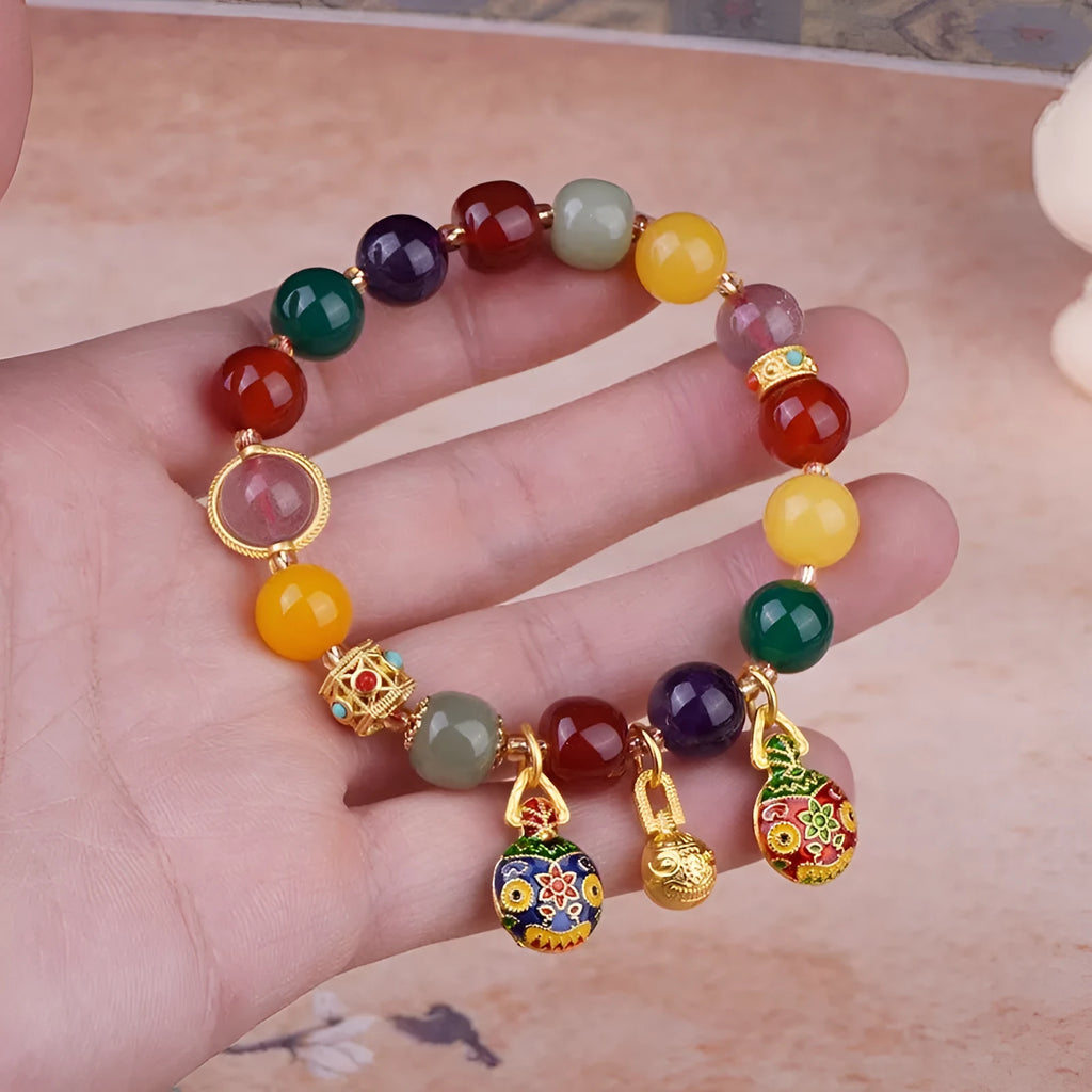 Hand-woven agate bracelet with Swallowing Gold Beast design on 10mm beads