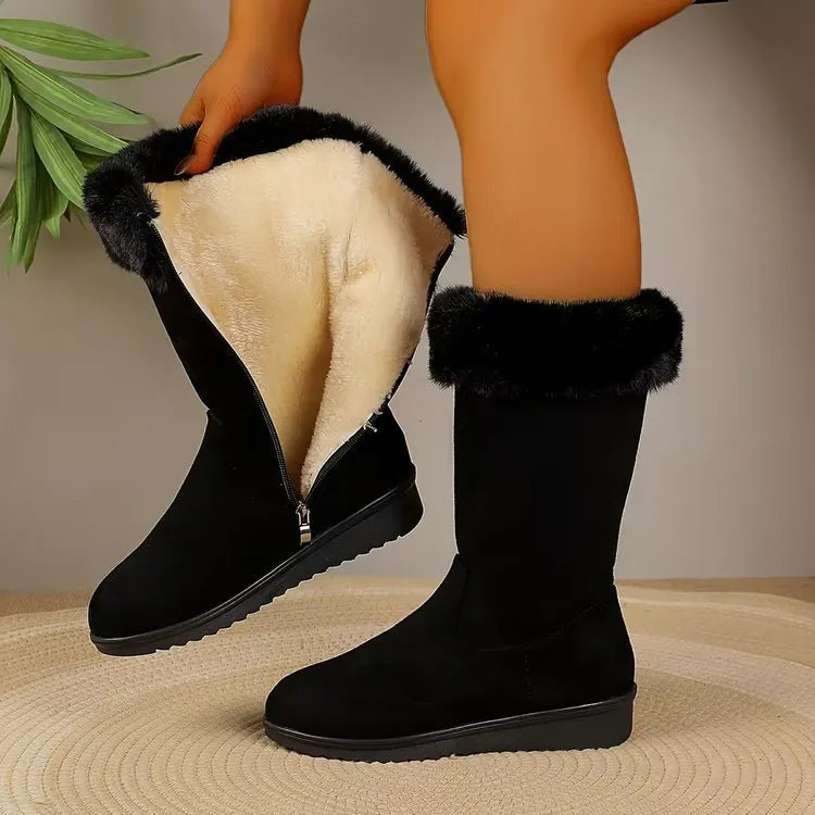 Fleece-lined mid-calf snow boots in black with waterproof platform sole and round toe, on a white background