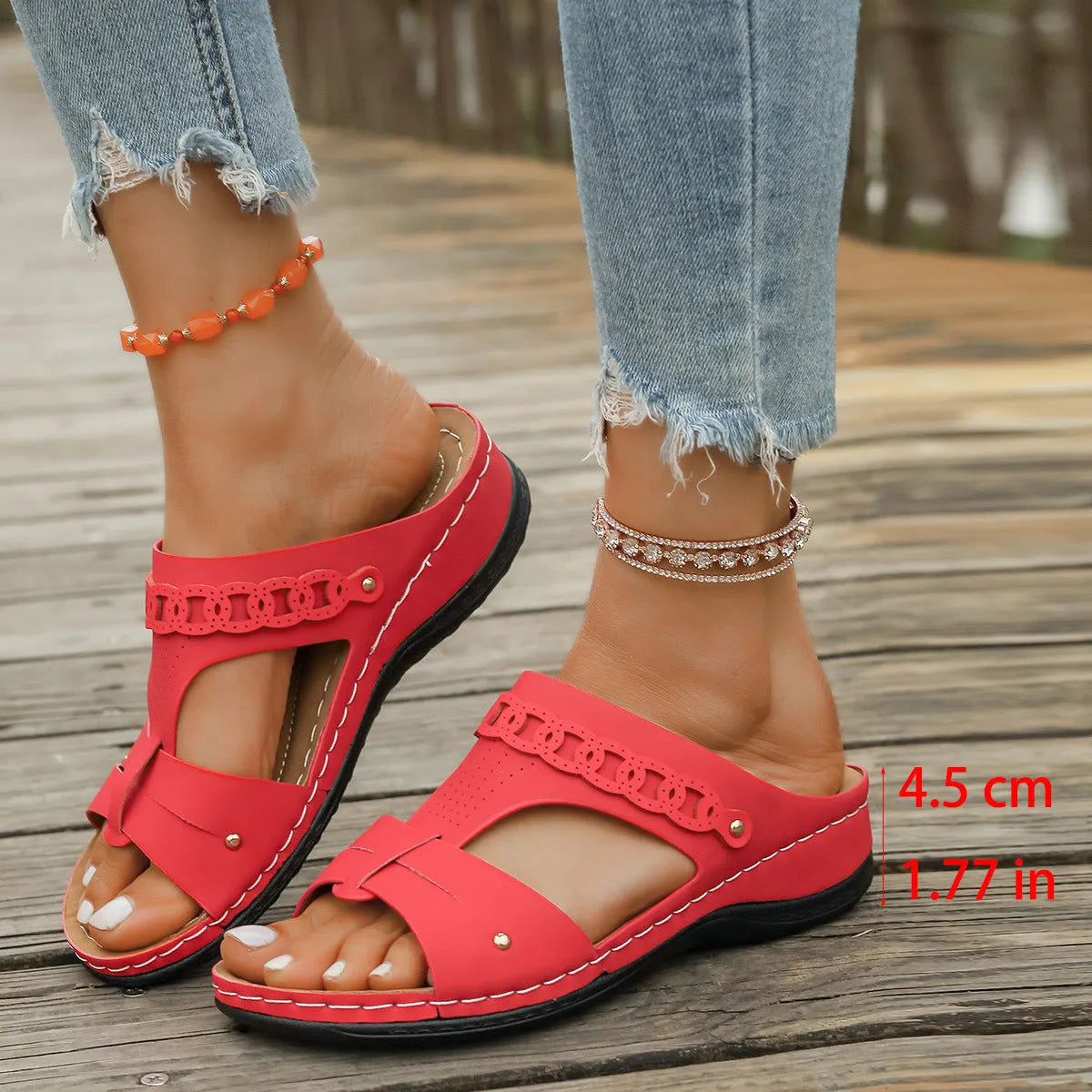 Blue Roman style casual slippers with a slope heel and fish mouth toe holder on a rubber sole.