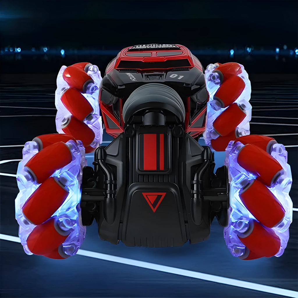 4WD RC stunt car with gesture remote control in red colour on white background showing off-road wheels and LED lights