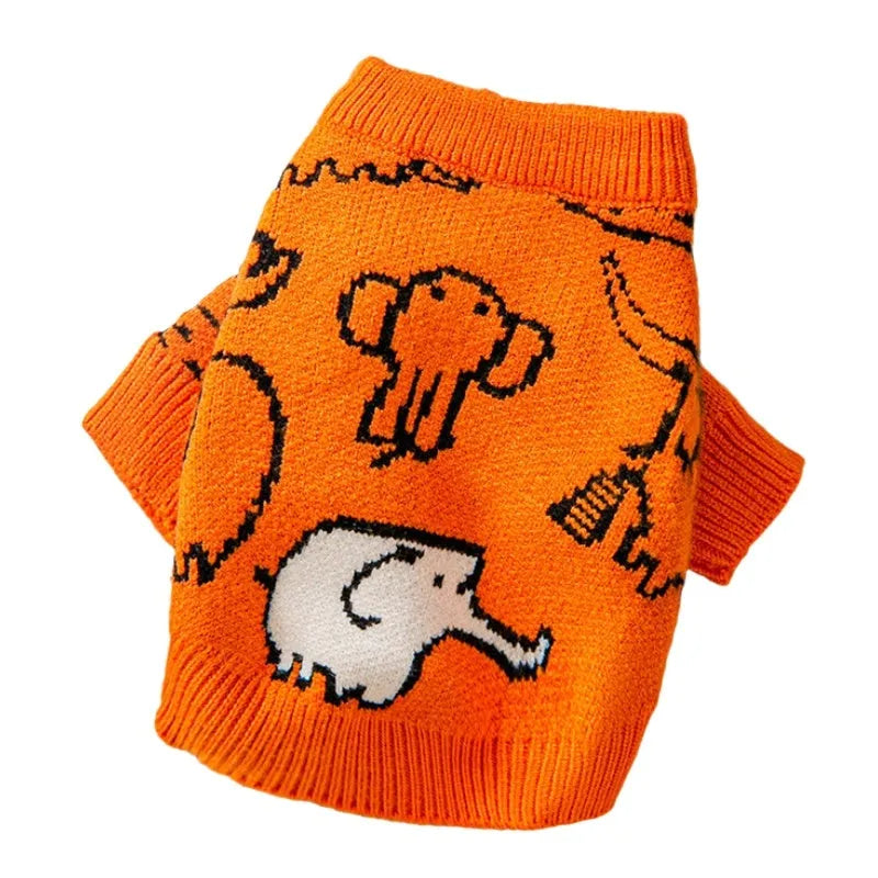 Small dog wearing a blue knitted winter sweater with a charming pattern, soft polyacrylic material